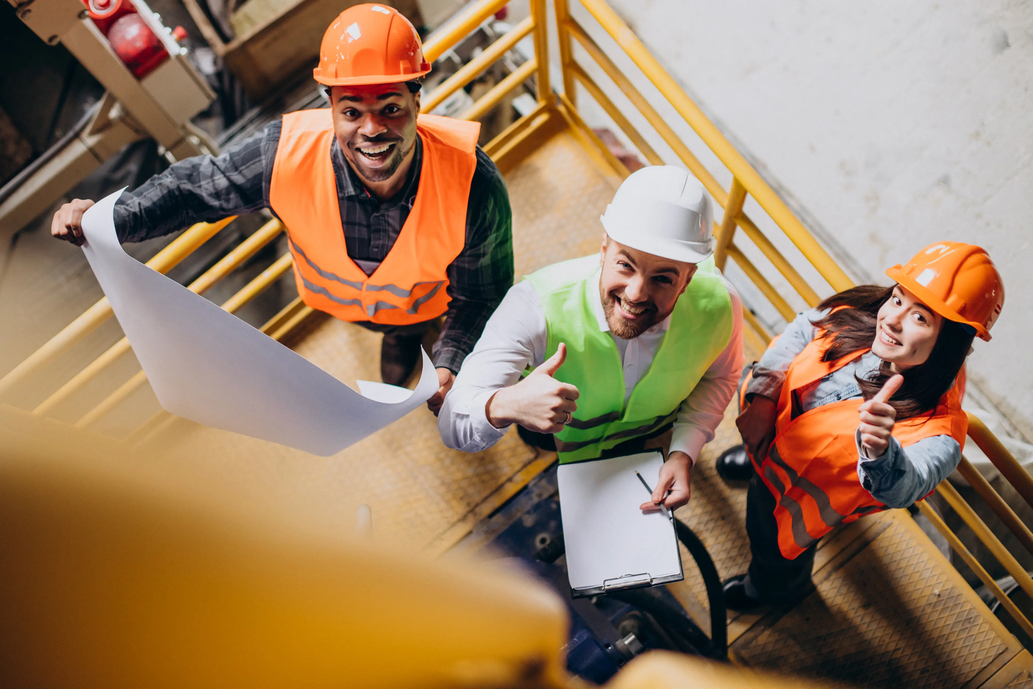 covers/three-factory-workers-safety-hats-discussing-manufacture-plan.webp
